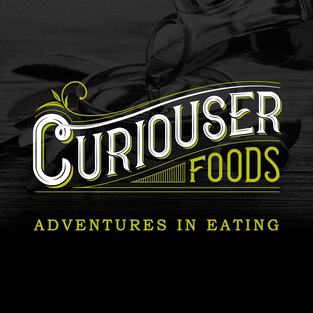 curiouser food logo